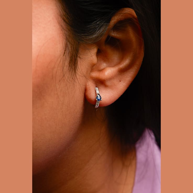 10K White Gold Pear Shaped Blue Sapphire and 1/10 Cttw Diamond Huggy
Hoop Earrings