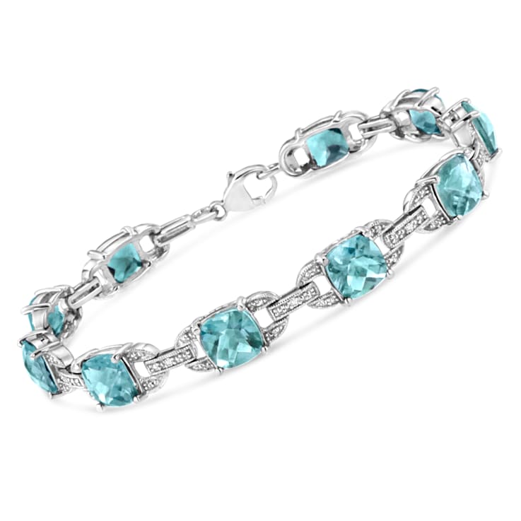 .925 Sterling Silver 7x7 mm Cushion Cut Blue Topaz and 1/20ctw Round Cut
Diamond Tennis Bracelet
