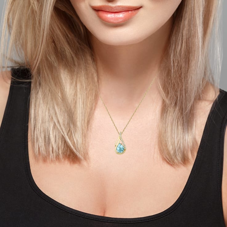 10k Yellow Gold Genuine Pear-shape Blue Topaz and Diamond Halo Drop
Pendant With Chain