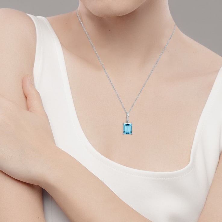 10k White Gold Genuine Emerald Cut Blue Topaz and White Topaz Pendant
With Chain