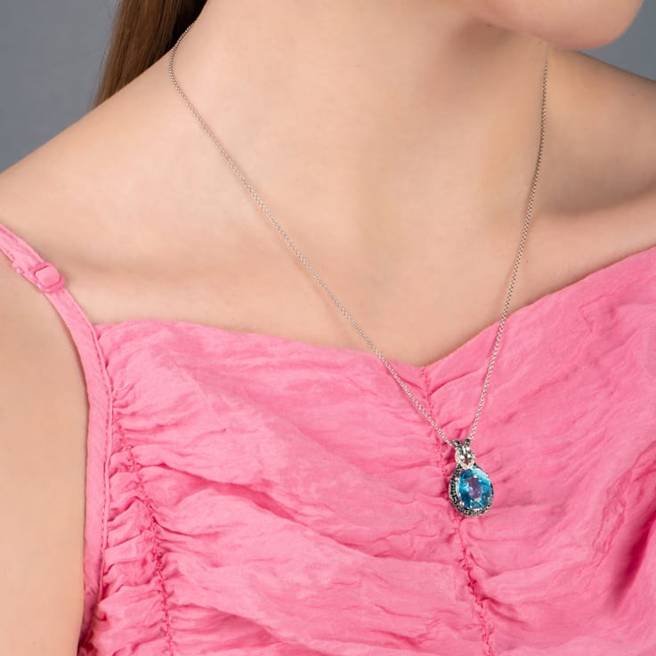 Jewelili Sterling Silver Swiss Blue Topaz, Blue and White Diamond Knot
Pendant with Rolo Chain