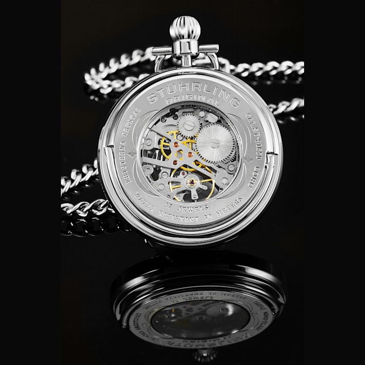 Stainless Steel Pocket Watch on Silver Tone Chain with White Bezel and
Black Accents.