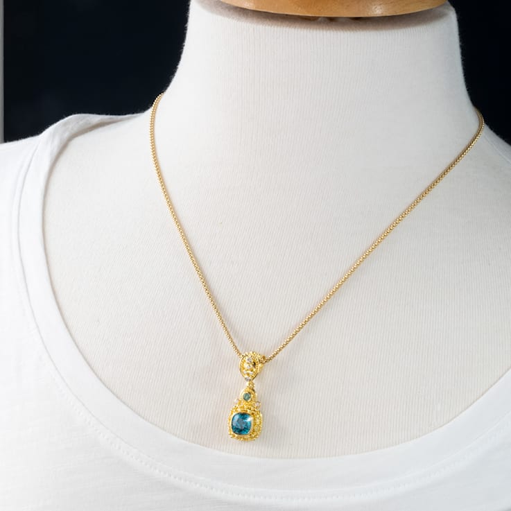 Classic Collection Pendant in 22kt & 18kt gold set with Blue Zircon,
Tourmalines and Diamonds
