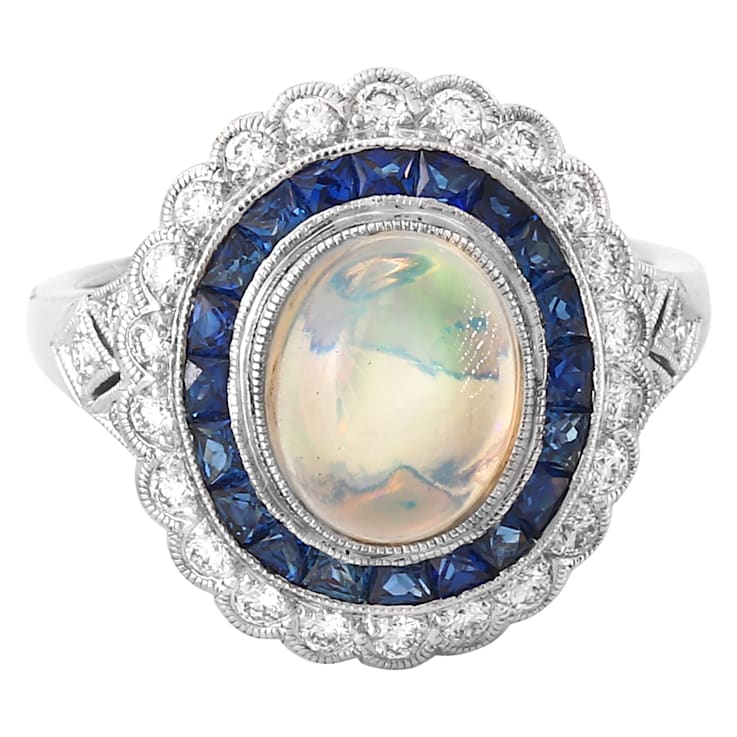 Beverley K 18K White Gold 0.35ctw Diamond and 0.76ctw Sapphire Ring set
with a 1.15ct Opal Center