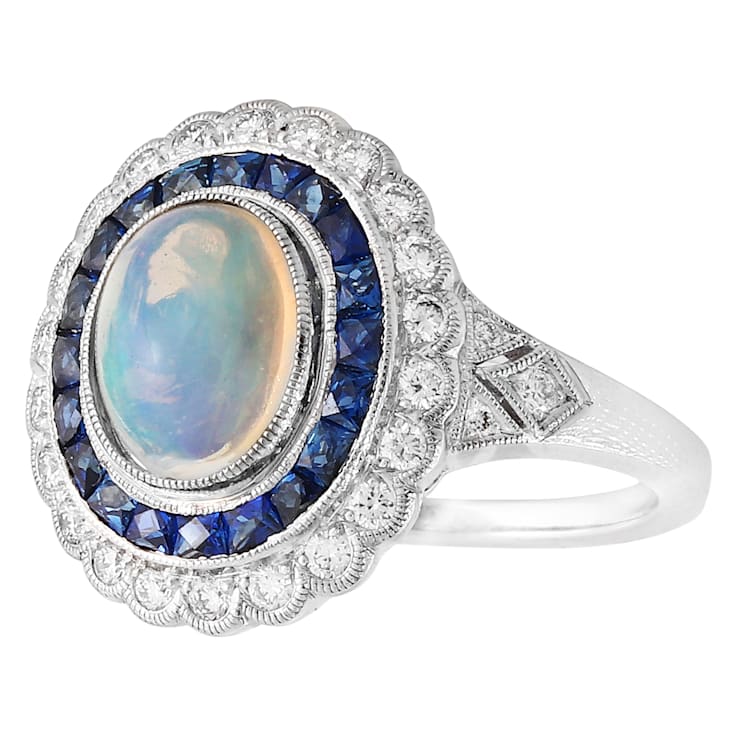Beverley K 18K White Gold 0.35ctw Diamond and 0.76ctw Sapphire Ring set
with a 1.15ct Opal Center
