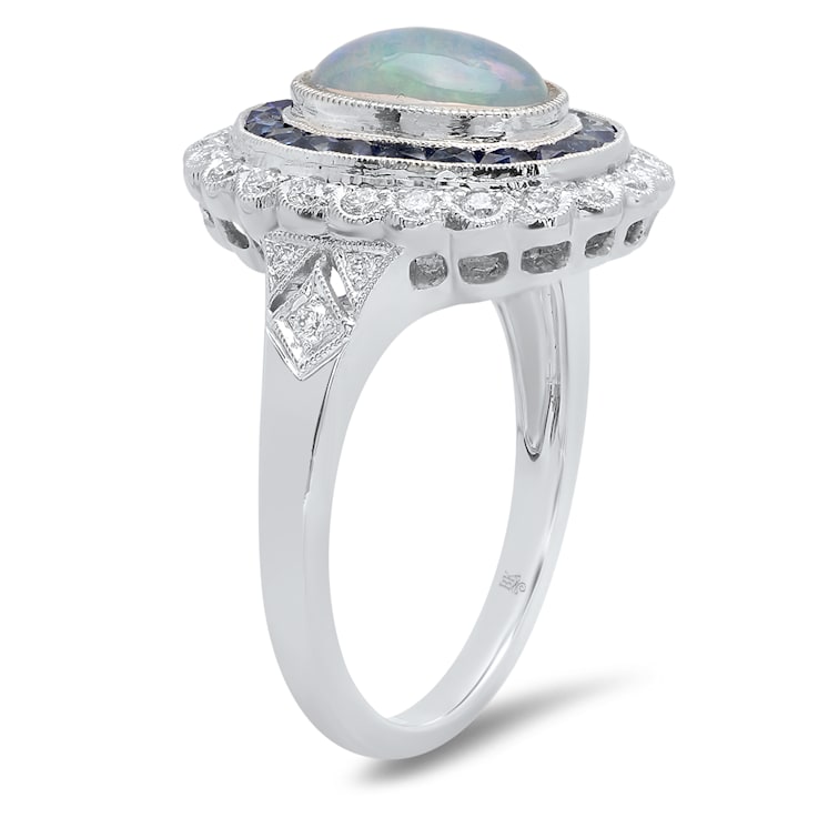 Beverley K 18K White Gold 0.35ctw Diamond and 0.76ctw Sapphire Ring set
with a 1.15ct Opal Center