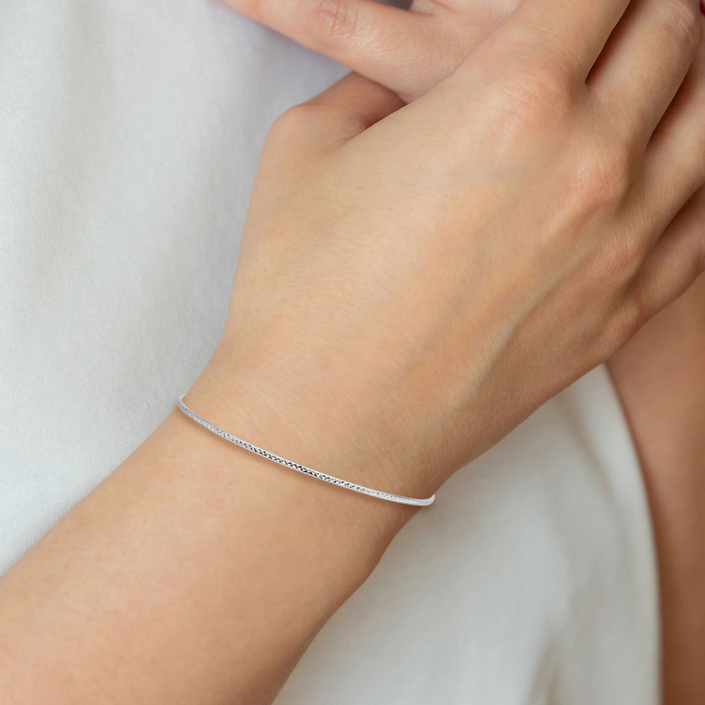 Rhodium Over 10k White Gold 1.5mm Diamond-Cut Slip-on Bangle