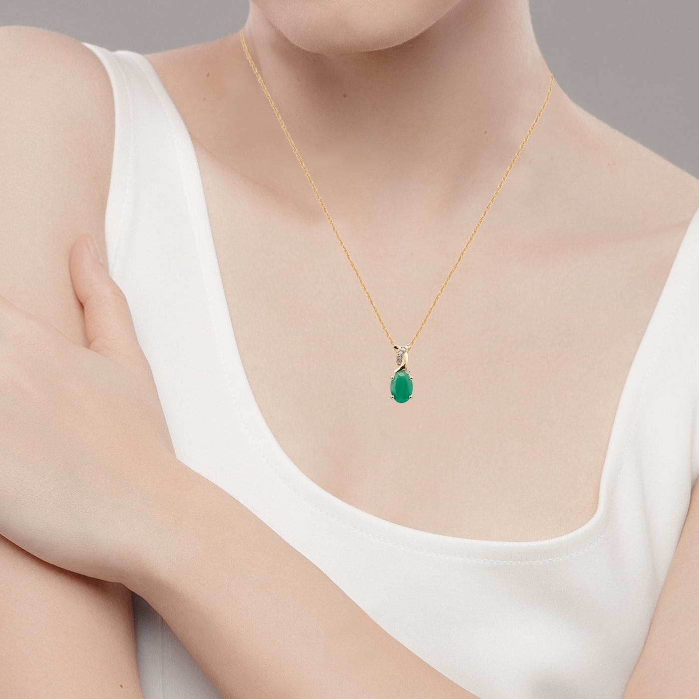 10k Yellow Gold Oval Emerald and Diamond Twist Pendant With
