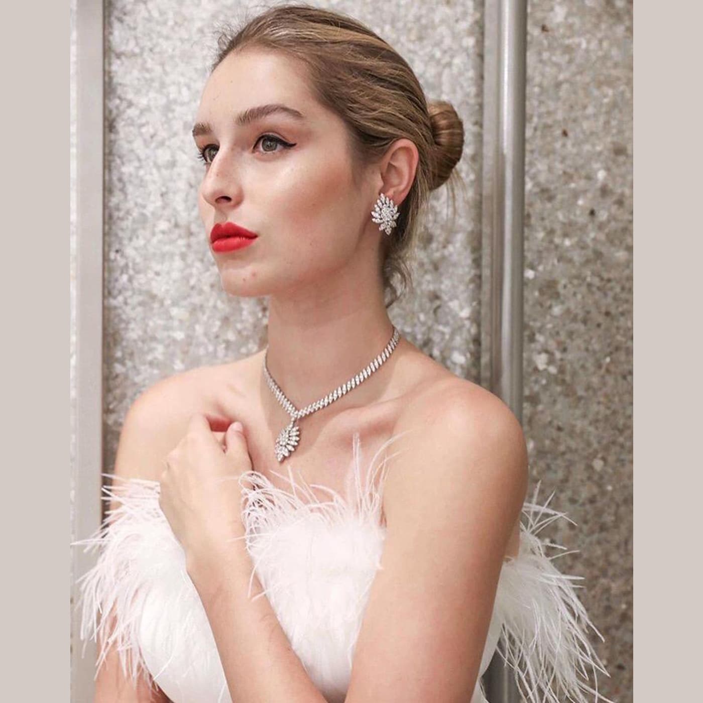 model wearing diamond cluster earrings 