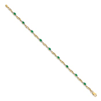 14k Yellow Gold and Rhodium Over 14k Yellow Gold Diamond and Oval
Emerald Bracelet