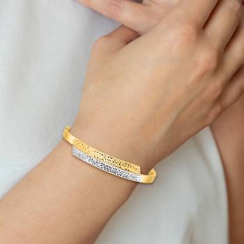 14k Yellow Gold and Rhodium Over 14k Yellow Gold 10mm Diamond-Cut
Overlap Hinged Bangle