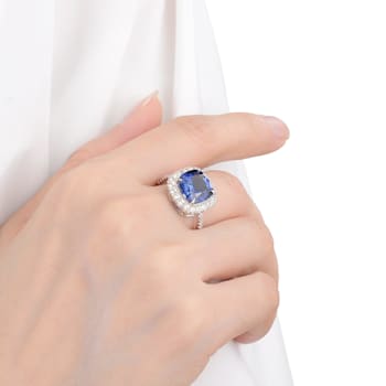 Lab Created Blue Sapphire and White Topaz Rhodium Over Sterling Silver
Halo Ring