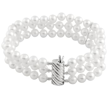 White 5-6mm triple row freshwater pearl bracelet with a sterling silver
clasp, 7"