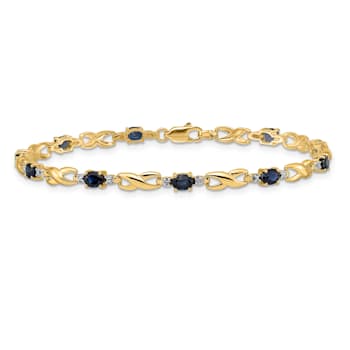 14k Yellow Gold and Rhodium Over 14k Yellow Gold Diamond and Oval
Sapphire Bracelet
