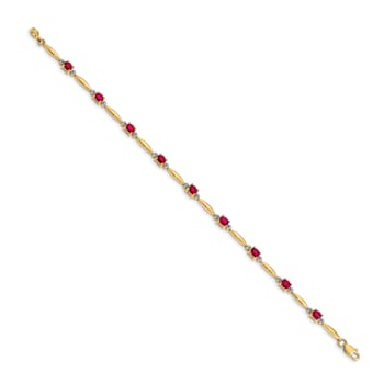 10k Yellow Gold and Rhodium Over 10k Yellow Gold Diamond and Oval Ruby Bracelet
