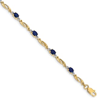 14k Yellow Gold and Rhodium Over 14k Yellow Gold Diamond and Oval
Sapphire Bracelet