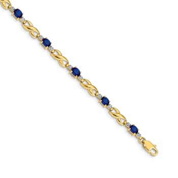 14k Yellow Gold and Rhodium Over 14k Yellow Gold Diamond and Oval
Sapphire Bracelet