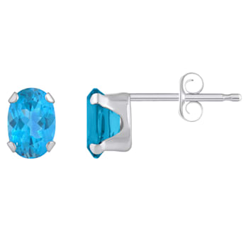 6x4mm Oval Blue Topaz Rhodium Over 10k White Gold Stud Earrings