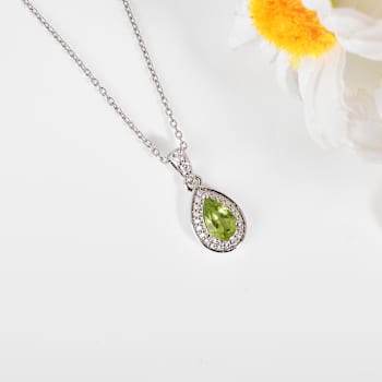 Pear Shape Peridot with Moissanite Accents Rhodium Over Sterling Silver
Pendant with Chain