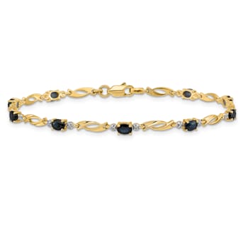 14k Yellow Gold and Rhodium Over 14k Yellow Gold Diamond and Oval
Sapphire Bracelet