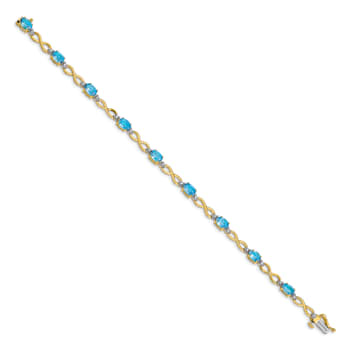 14k Yellow and White Gold with Rhodium Over 14k Yellow Gold Blue Topaz
and Diamond Infinity Bracelet