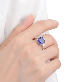 Lab Created Blue Sapphire and White Topaz Rhodium Over Sterling Silver Ring