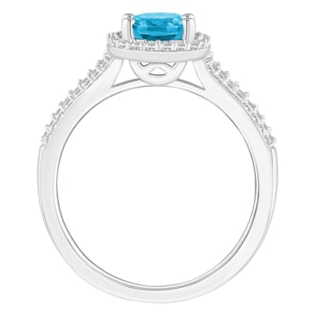 8x6mm Oval Blue Topaz 1/4 ctw Diamond Rhodium Over Sterling Silver Halo Ring