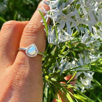 Pear Shape Lab Created Opal with Moissanite Accents Rhodium Over
Sterling Silver Halo Ring