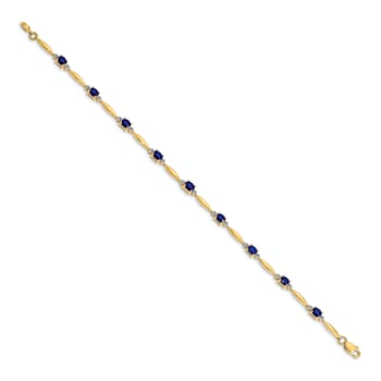 14k Yellow Gold and Rhodium Over 14k Yellow Gold Diamond and Oval
Sapphire Bracelet