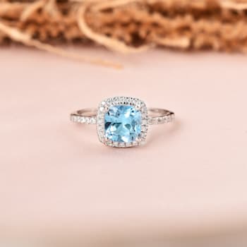 Cushion Swiss Blue Topaz with Moissanite Accents Rhodium Over Sterling
Silver Halo Ring 1.75ctw