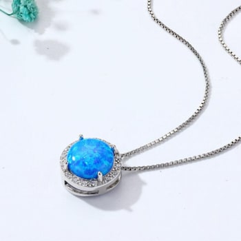 Lab Created Blue Opal and White CZ Accents Rhodium Over Sterling Silver
Pendant Style Necklace