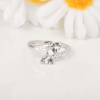 Trillion Aquamarine and White Topaz 2-Stone Rhodium Over Sterling Silver
Bypass Ring 1.22ctw