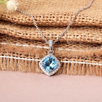 Swiss Blue Topaz December Birthstone Necklace with Moissanite Accents
Rhodium Over Sterling Silver