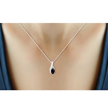 0.28ct Oval Black Sapphire with White Diamond Accent Rhodium Over
Sterling Silver Pendant with Chain