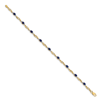 14k Yellow Gold and Rhodium Over 14k Yellow Gold Diamond and Oval
Sapphire Bracelet