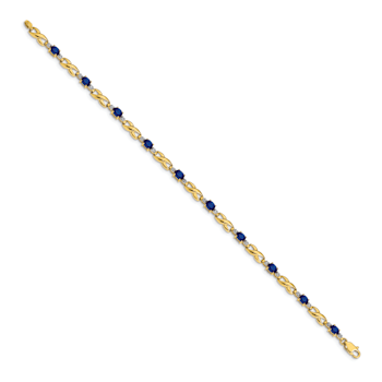 14k Yellow Gold and Rhodium Over 14k Yellow Gold Diamond and Oval
Sapphire Bracelet