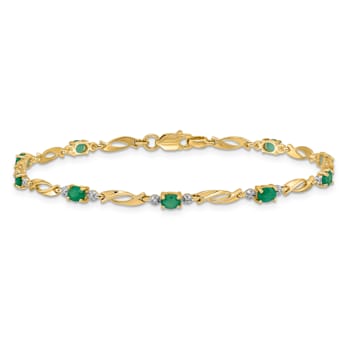 14k Yellow Gold and Rhodium Over 14k Yellow Gold Diamond and Oval
Emerald Bracelet