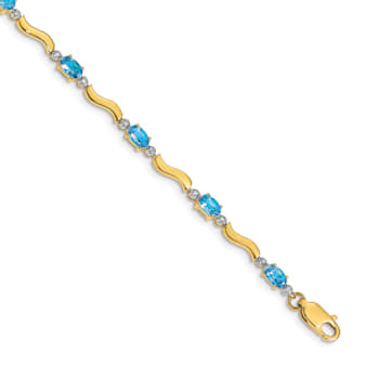 14k Yellow Gold and Rhodium Over 14k Yellow Gold Fancy Diamond and Blue
Topaz Bracelet