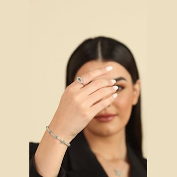 Emerald with Moissanite Accents Rhodium Over Sterling Silver Evil Eye
Halo Ring
