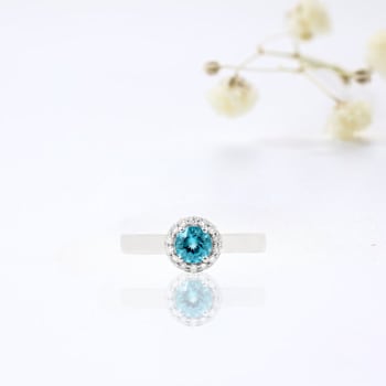 Paraiba Blue Apatite and Lab Grown Diamond Accent Ring Rhodium Over
Sterling Silver 0.69ctw