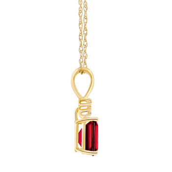 7x5mm Emerald Cut Garnet with Diamond Accents 14k Yellow Gold Pendant
With Chain