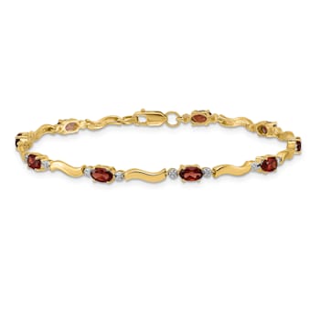 14k Yellow Gold and Rhodium Over 14k Yellow Gold Fancy Diamond and
Garnet Bracelet