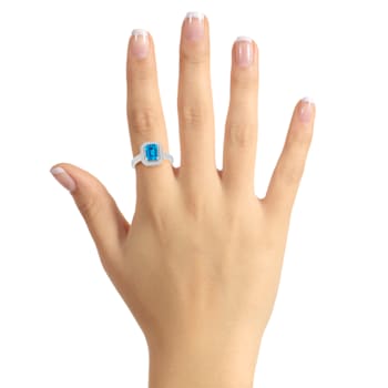 8x6mm Emerald Cut Blue Topaz 1/5 ctw Diamond Rhodium Over Sterling
Silver Halo Ring