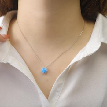 Lab Created Blue Opal and White CZ Accents Rhodium Over Sterling Silver
Pendant Style Necklace