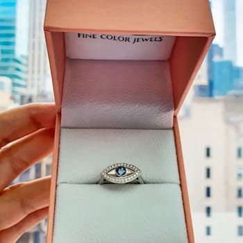 Blue Topaz with Moissanite Accents Rhodium Over Sterling Silver Evil Eye
Halo Ring