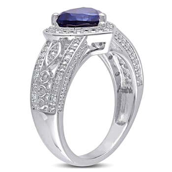 2 1/4 CT TGW Created Blue Sapphire and 1/10 CT TW Diamond Heart Ring in
Sterling Silver