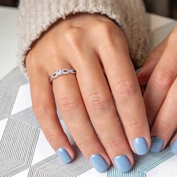 1/4 CT TGW Created White Sapphire and 1/10 CT TW Diamond Infinity
Engagement Ring in Sterling Silver