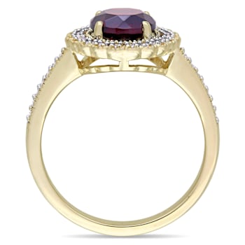 1 5/8 CTW Garnet and 1/8 CT TW Diamond Halo Ring in Yellow Plated
Sterling Silver