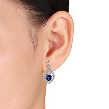 1 1/8 CT TGW Created Blue Sapphire and 1/8 CT TW Diamond Heart Twist
Earrings in Sterling Silver
