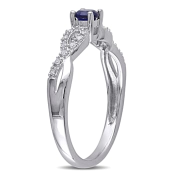1/5 CT TGW Created Blue Sapphire and 1/10 CT TW Diamnond Infinity Ring
in Sterling Silver